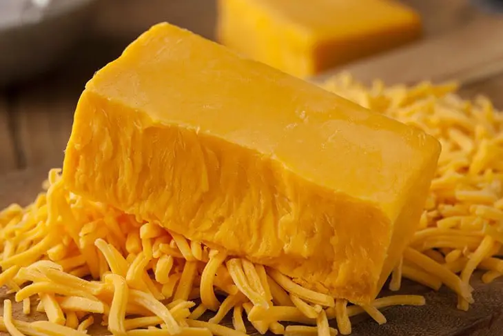 This image has an empty alt attribute; its file name is Cheddar-Cheese.jpg